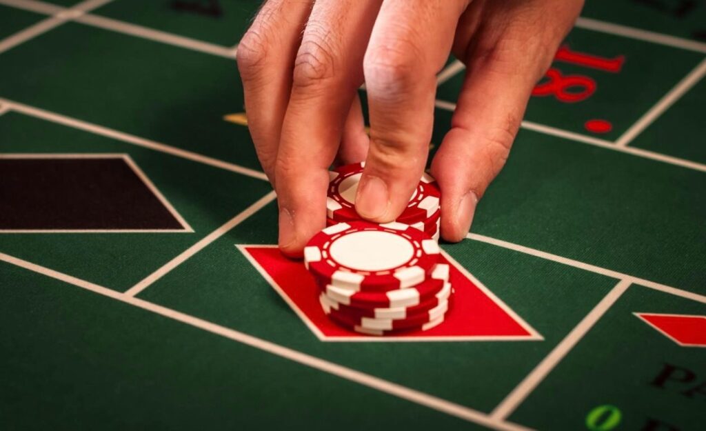 placing a bet on a roulette table